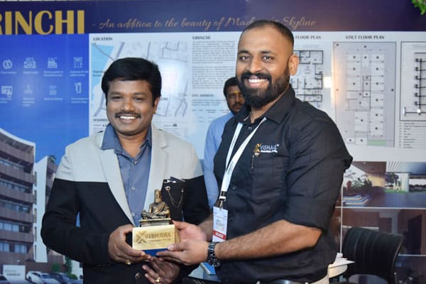 Award presentation ceremony at Vishaal Promoters real estate exhibition booth