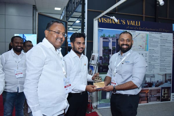 Vishaal Promoters team receiving award at property exhibition