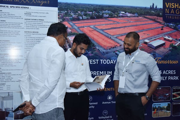 Vishaal Promoters project discussion with visitors at exhibition