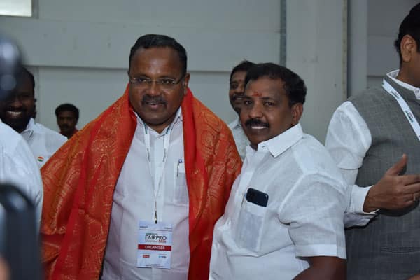 Vishaal Promoters officials interacting with guests during real estate event